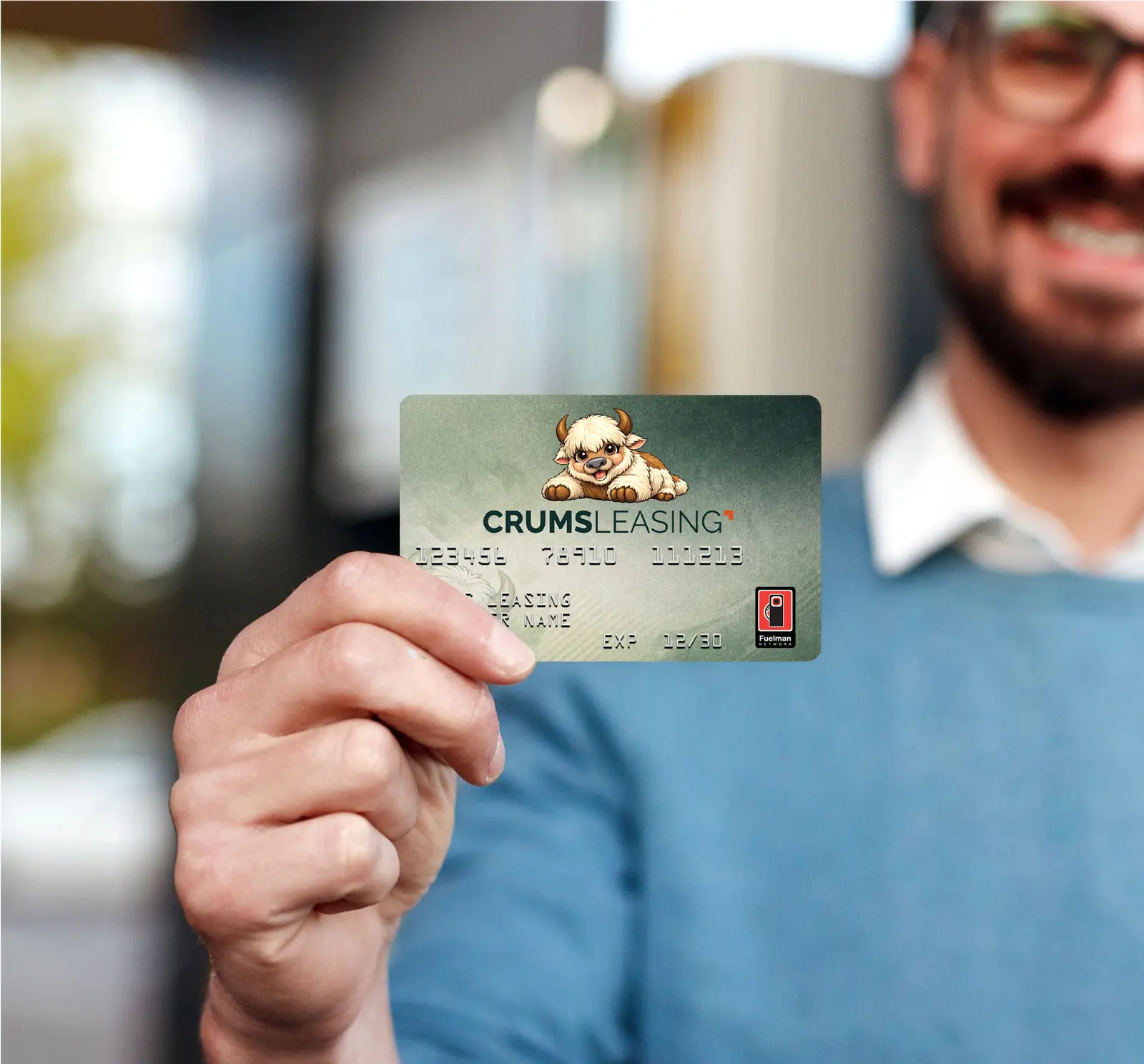 Driver holding the CRUMS Leasing Fleet Fuel Card