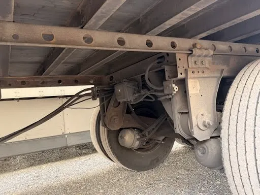 Axle brake assembly and suspension components showing ABS system and air lines