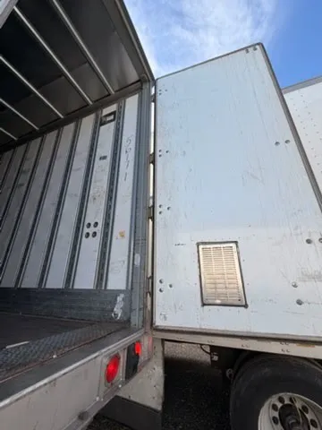 Rear door with ventilation panel and door locking mechanism detail