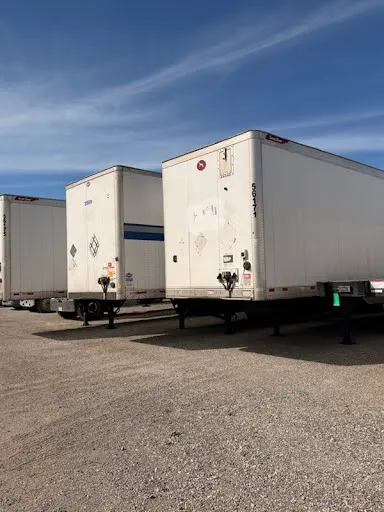 CRUMS Leasing fleet yard with multiple dry van trailers including unit 56171