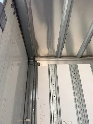 Interior logistic posts and E-track rails for secure load tie-down and cargo securement
