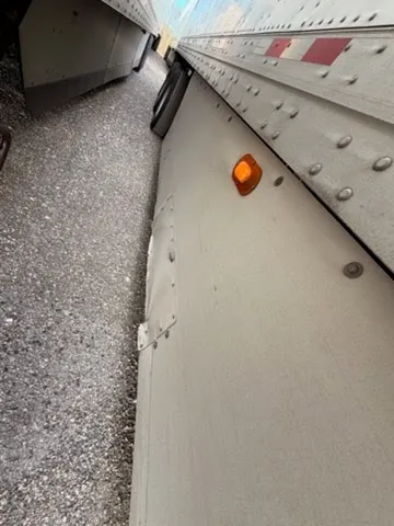 Landing gear clearance marker light and lower panel showing proper ground clearance and DOT reflectors
