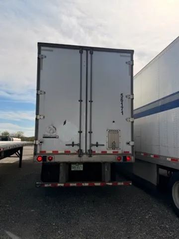 Trailer 56171 rear swing doors closed with safety reflective tape and DOT compliance stickers